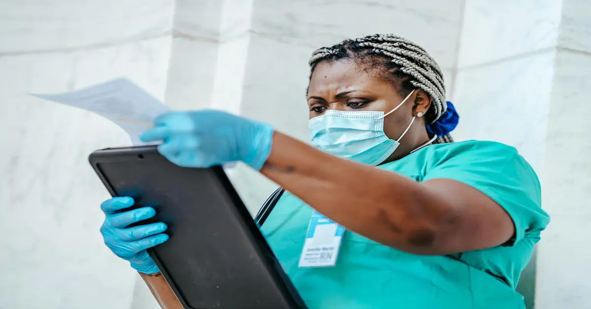 A qualified Registered Nurse in theatre scrubs standing in a modern operating room at Life Eugene Marais Hospital.