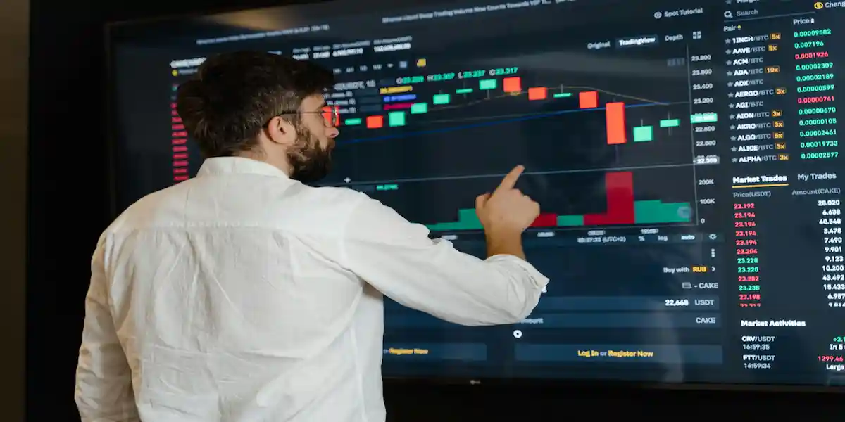 Academic Data Analyst working on a laptop with Excel and Power BI dashboards, analyzing higher education performance and regulatory reporting data at a university office in South Africa.