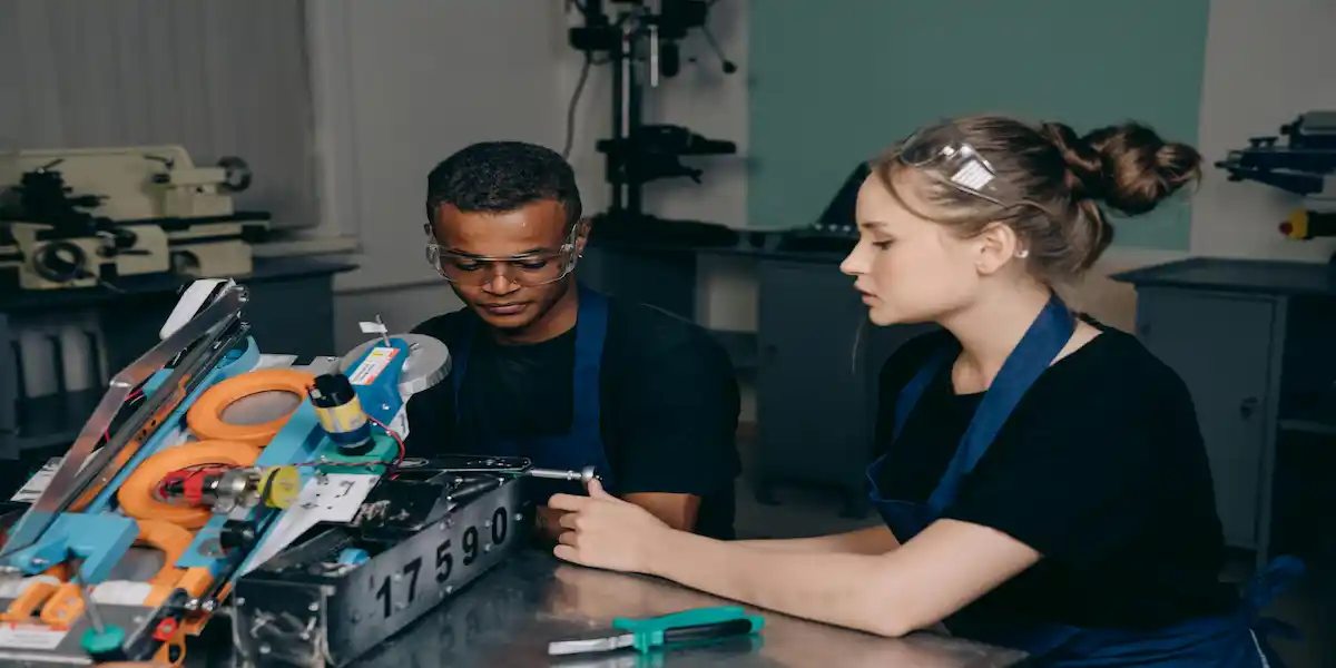 South African Airways Technical apprentices performing aircraft maintenance on a jet engine.